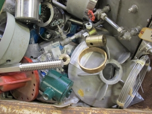 SCRAPPERS DELIGHT! FULL SKIFF STACKED WITH MISC. STAINLESS STEEL, BRASS, BRONZE, AND HEAVY STEEL. SKIFF NOT INCLUDED. LOADING & HANDLING FEE $30-4617